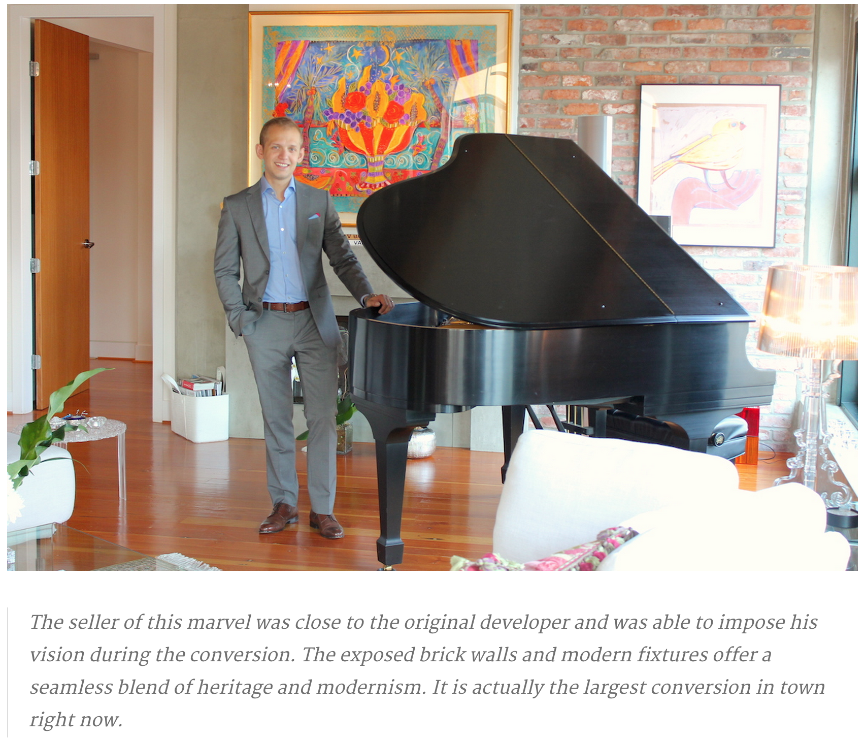 paul albrighton stands by the grand piano at 1180 homer street   vancouvers finest loft at 46m