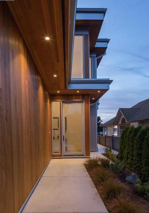 Clear Coated Cedar and Metal Detail work on this modern home located on the beach